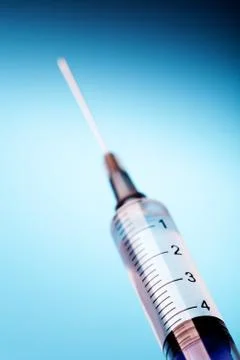 Close up of a syringe. Stock Photos
