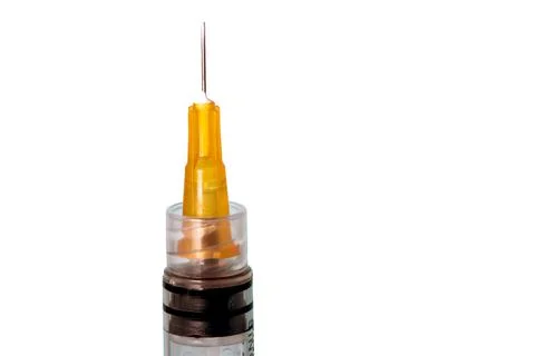 Close up of syringe top with needle on white background. Medical concept with Stock Photos