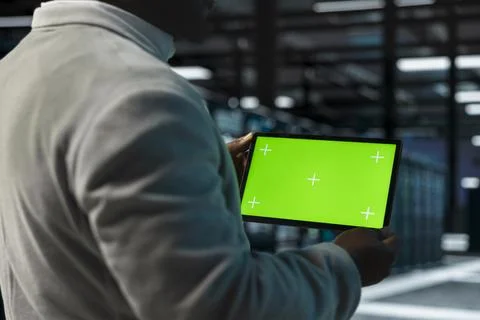 Close up of system administrator in data center using green screen tablet Stock Photos