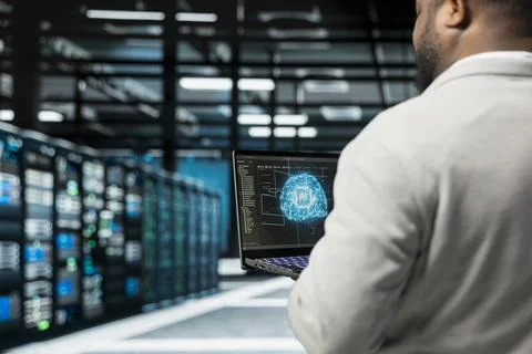 Close up of system administrator programming in AI data center 写真素材