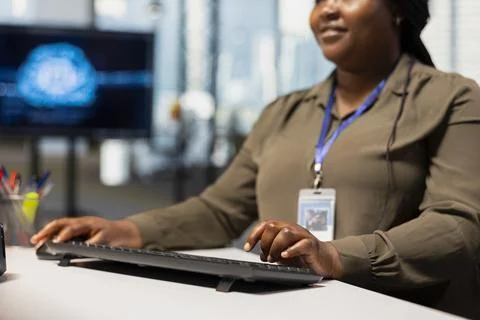 Close up of system administrator speeding up tasks by following AI suggestions Photos