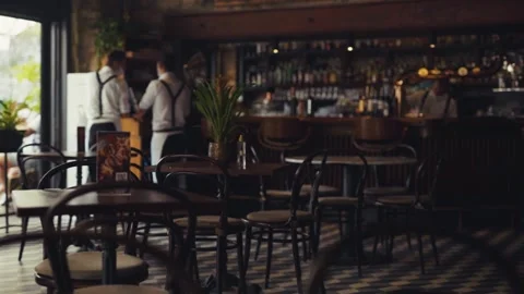 Close up table in cafe on background team waiters in face mask work in cafeteria Stock Footage 138702214