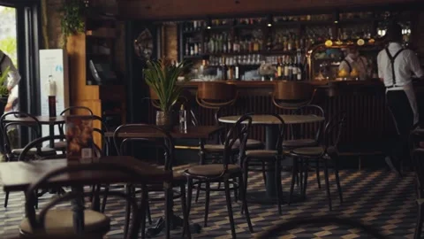 Close up table in cafe on background team waiters in face mask work in cafeteria Stock Footage 138702316