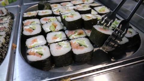 Close-up of a table with different types of sushi laid out on it 스톡 동영상 305404219