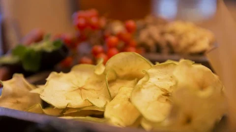 Close up of the table with dried slices of apples, red cranberries, mint leaves Vidéo 129606735