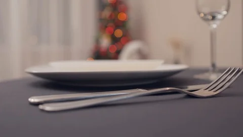 Close-up of table forks and white plates on a table Video stock 128571844