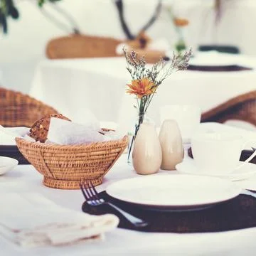 Close up of a table setting at a beach restaurant Stock Photos