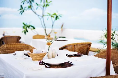 Close up of a table setting at a beach restaurant Stock Photos
