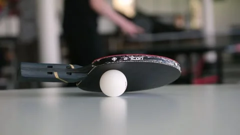 Close Up of Table Tennis Racket and Ball on Professional Indoor Table Stock Footage 335114827