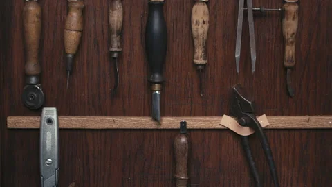 Close up table with tools for making shoes. Craft production. Cinematic light Stock-Footage 138307686
