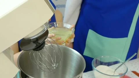 Close-up On the table top there is a kitchen machine, ready to go. The child Stock Footage 151131692