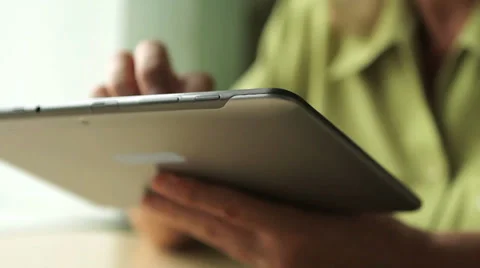 Close-up of a tablet computer in the hands of women aged Stock Footage 29678113