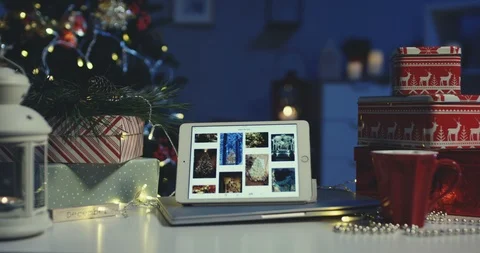 Close up of the tablet computer with winter pictures on its screen on the table Stock-Footage 99797251