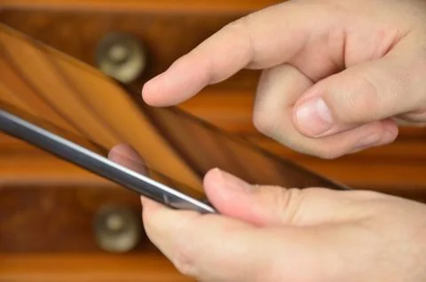 Close-up of tablet in hands Stock Photos