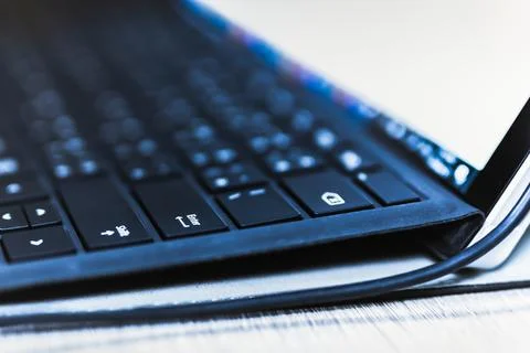 Close up tablet keyboard computer focus at enter button. Stock Photos