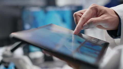 Close up of tablet with modern laboratory software used by scientist Stock Footage 317784113
