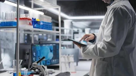 Close up of tablet with modern laboratory software used by scientist Stock Photos