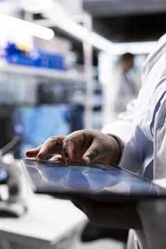 Close up of tablet with modern laboratory software used by scientist Stock Photos