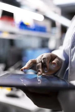 Close up of tablet with modern research study results in a chemistry lab Stock Photos
