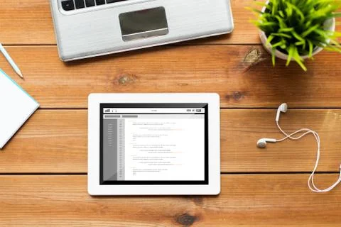 Close up of tablet pc computer on wooden table 库存照片