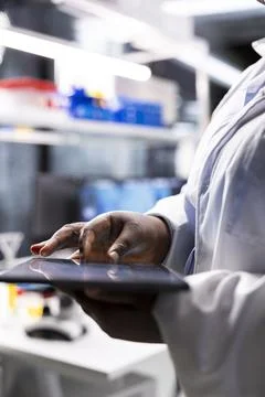 Close up of tablet running important experiment data in a research lab Stock Photos