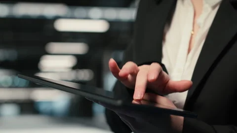 Close up of tablet used by data center admin troubleshooting supercomputers Stock Footage 329323831