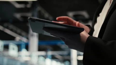 Close up of tablet used by data center admin troubleshooting supercomputers Stock Footage 329332120