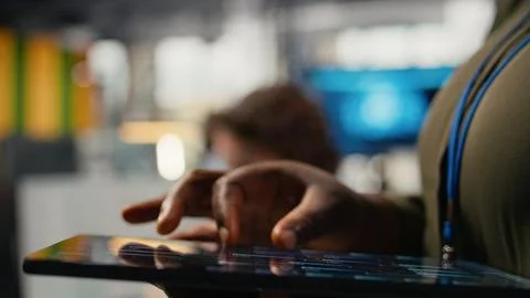 Close up of tablet used by programmer in office to accelerate tasks Foto stock