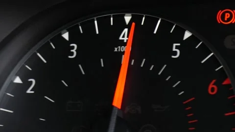 Close-up of the tachometer, RPMS gauge on the dash of a car as the engine Stock Footage 151970086