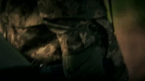 Close-Up of Tactical Soft Stretcher Held by Combat Medic in Forest Stock Footage 297274138