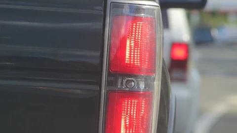 Close up of the tail lights of a vehicle at a stop light Stock Footage 91925481