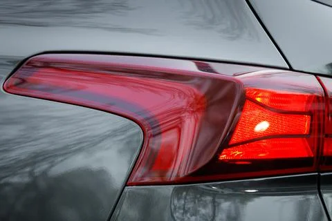 Close-up on the taillight of a gray car Stock Photos