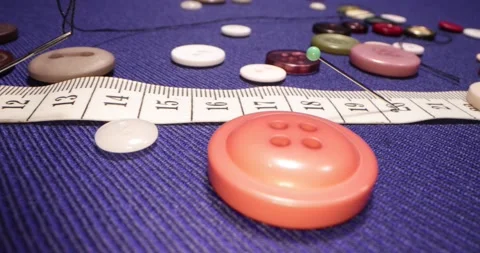 Close up of a tailor's work desk with tailoring tools, pins, buttons. Stock-Footage 168251474