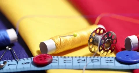 Close up of a tailor's work desk with tailoring tools, pins, buttons, sewing Stock Footage 168373984