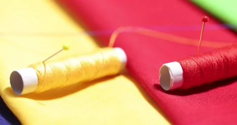 Close up of a tailor's work desk with tailoring tools, pins, buttons, sewing Stock Footage 168374163
