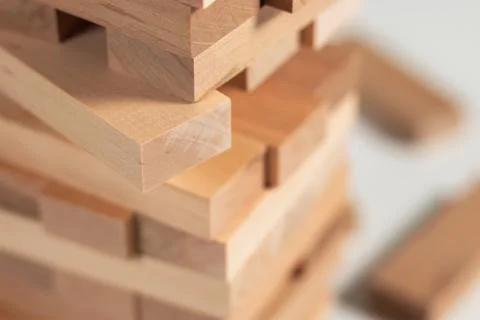 Close up take one block on The tower from wooden blocks. 스톡 사진