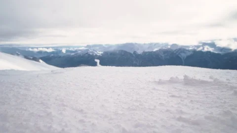 Close take of a snowboarder diving into a snowboarder diving into snow powder in Video stock 101788134
