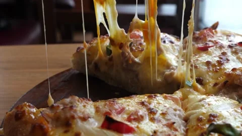 Close up taking pizza slice with onion olive tomato hot melted cheese is Stock-Footage 336586714
