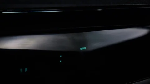 Close-up of taking the VHS video cassette and loading in VCR 4k Stock Footage 123456027
