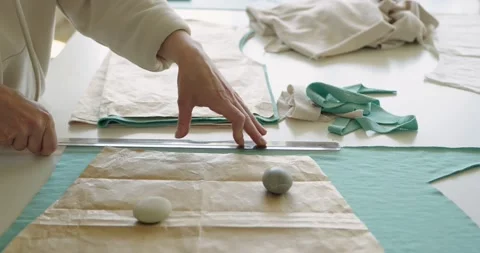 Close up of talented female tailor drawing with soap, make up patterns on fabric Stock Footage 200955474