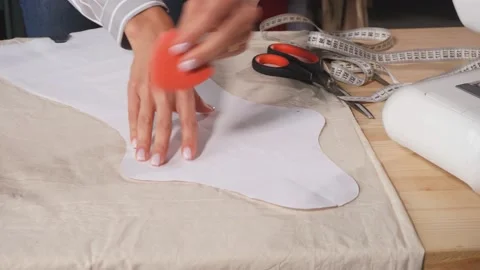 Close up talented tailor draws with soap , make up patterns on fabric Stock Footage 118923674