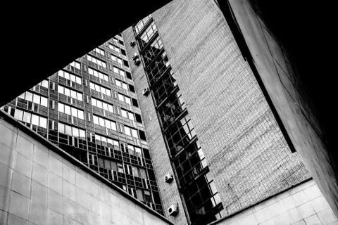 A close up of a tall building. Window. Geometry. Sky Stock Photos