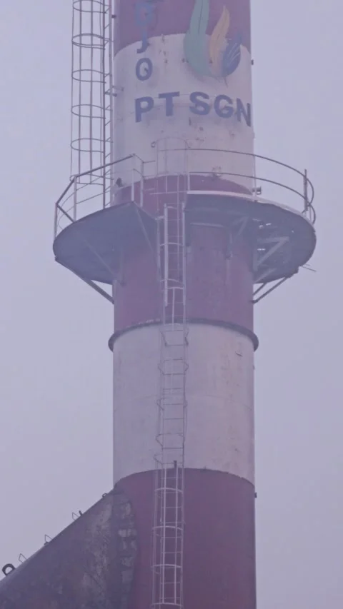 Close Up Of Tall Red And White Industrial Chimney Of Sugar Factory In Fog Stock Footage 340199527