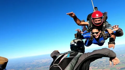 Close Up on a tandem parachute jump. Stock Footage 155646394