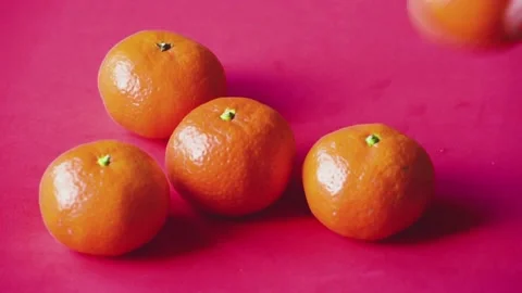 Close-up tangerines on red background, Christmas time fruit, arm take away all Stock Footage 167651341