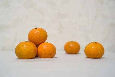 Close up tangerines on white table surface Stock Photos