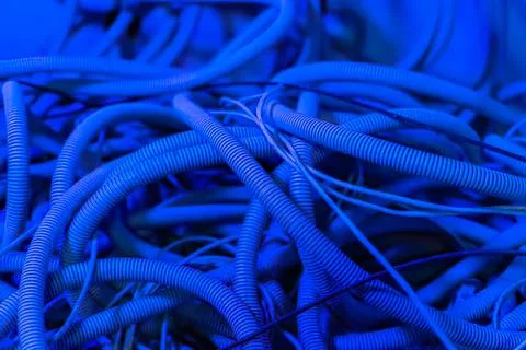 Close-up of tangled blue cables with textured surface Stock Photos