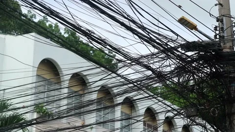 Close-up of tangled electric wires in the Philippines at daytime Stock Footage 201326634