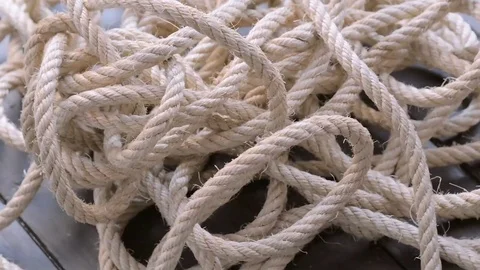 Close-up of a tangled rope spinning. Video stock 74513927