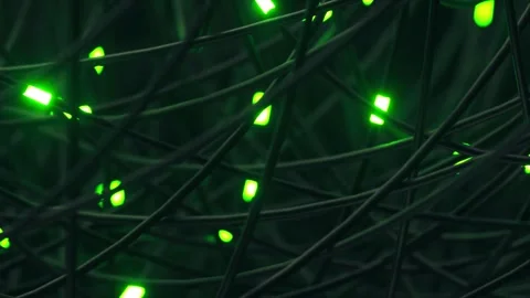 Close up of tangled web of wires with bright pulsing green light spots Stock Footage 327521778